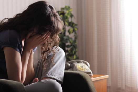 Seated woman crying